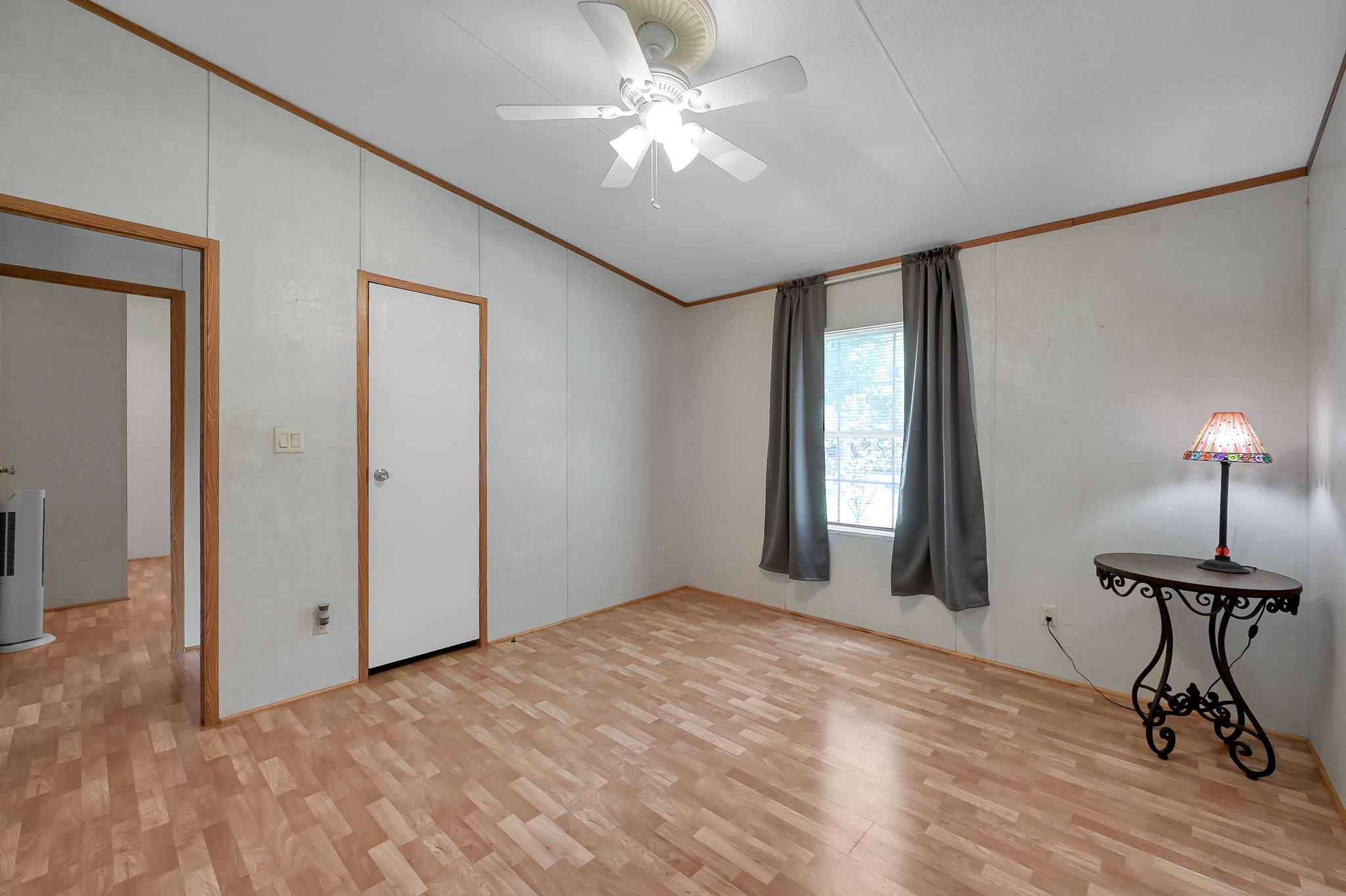 15350 Old Humble Pipeline Road Conroe, TX 77302 - Photo 19 of 38 a view of a room with a ceiling fan and windows