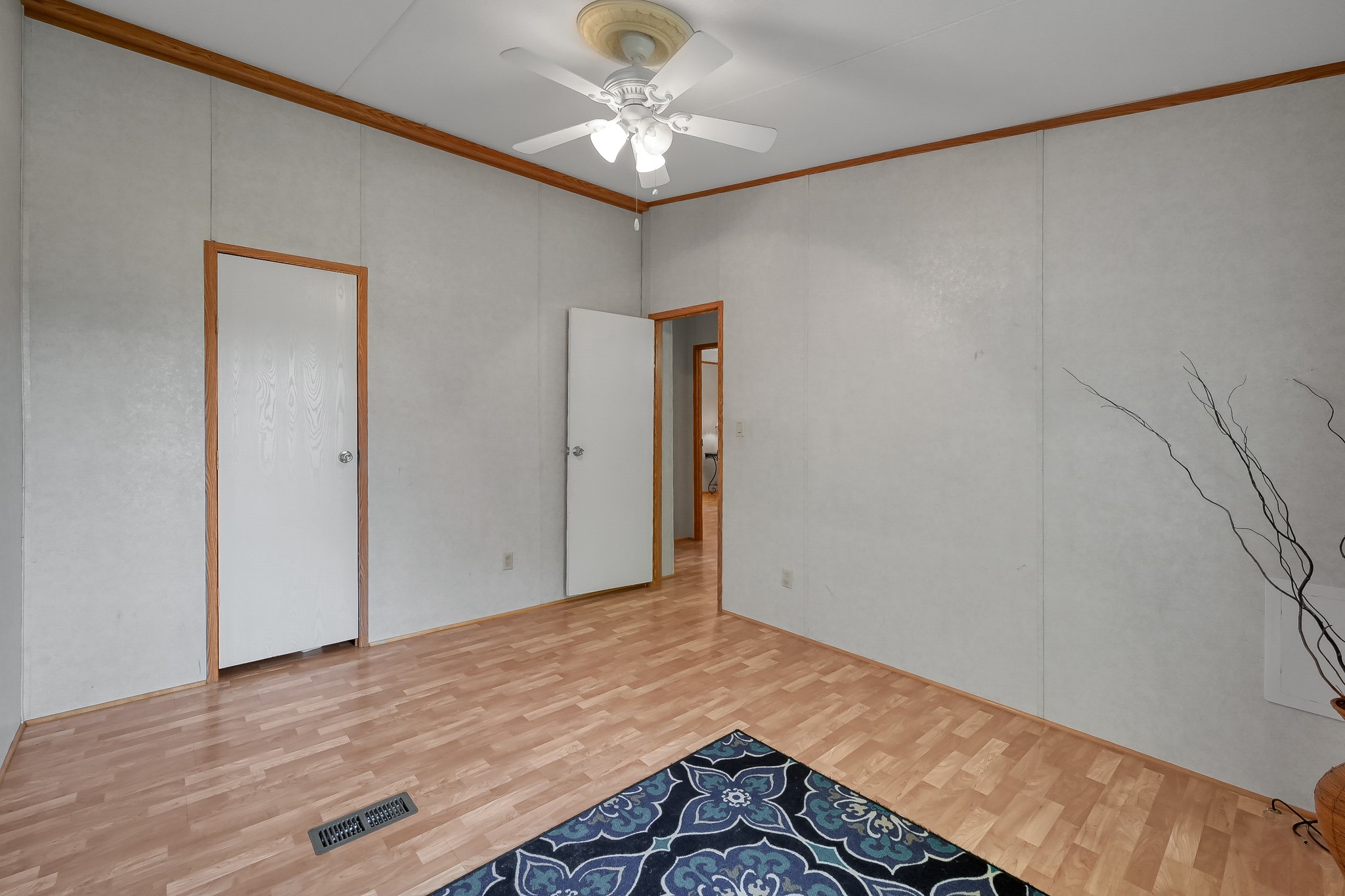 15350 Old Humble Pipeline Road Conroe, TX 77302 - Photo 23 of 38 a view of empty room with wooden floor and fan