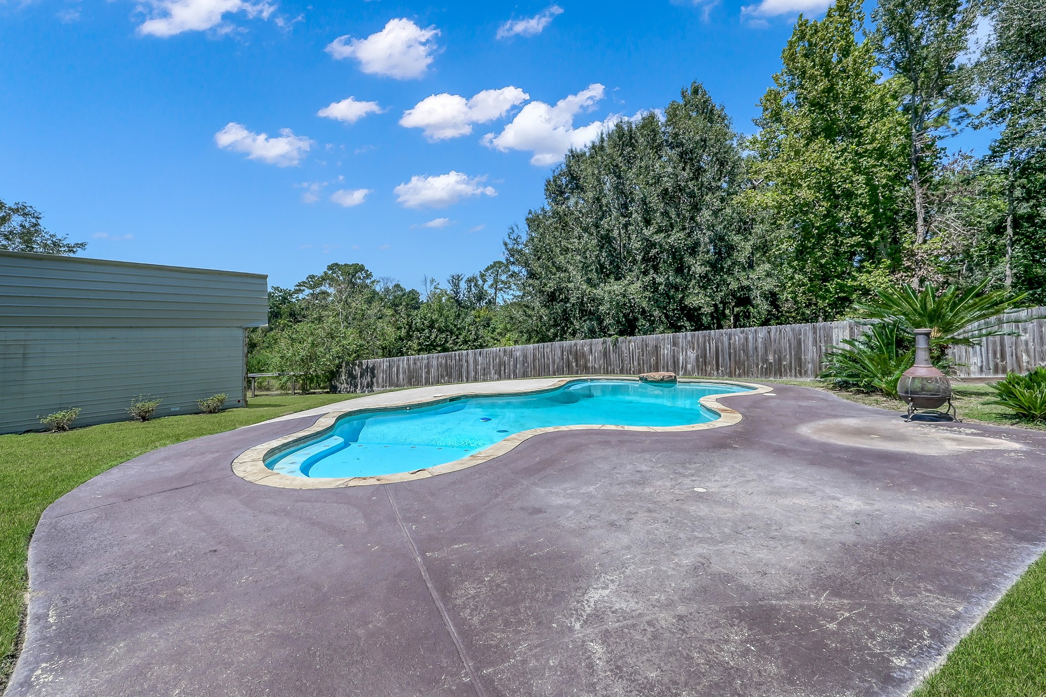 15350 Old Humble Pipeline Road Conroe, TX 77302 - Photo 27 of 38 a view of a backyard with swimming pool