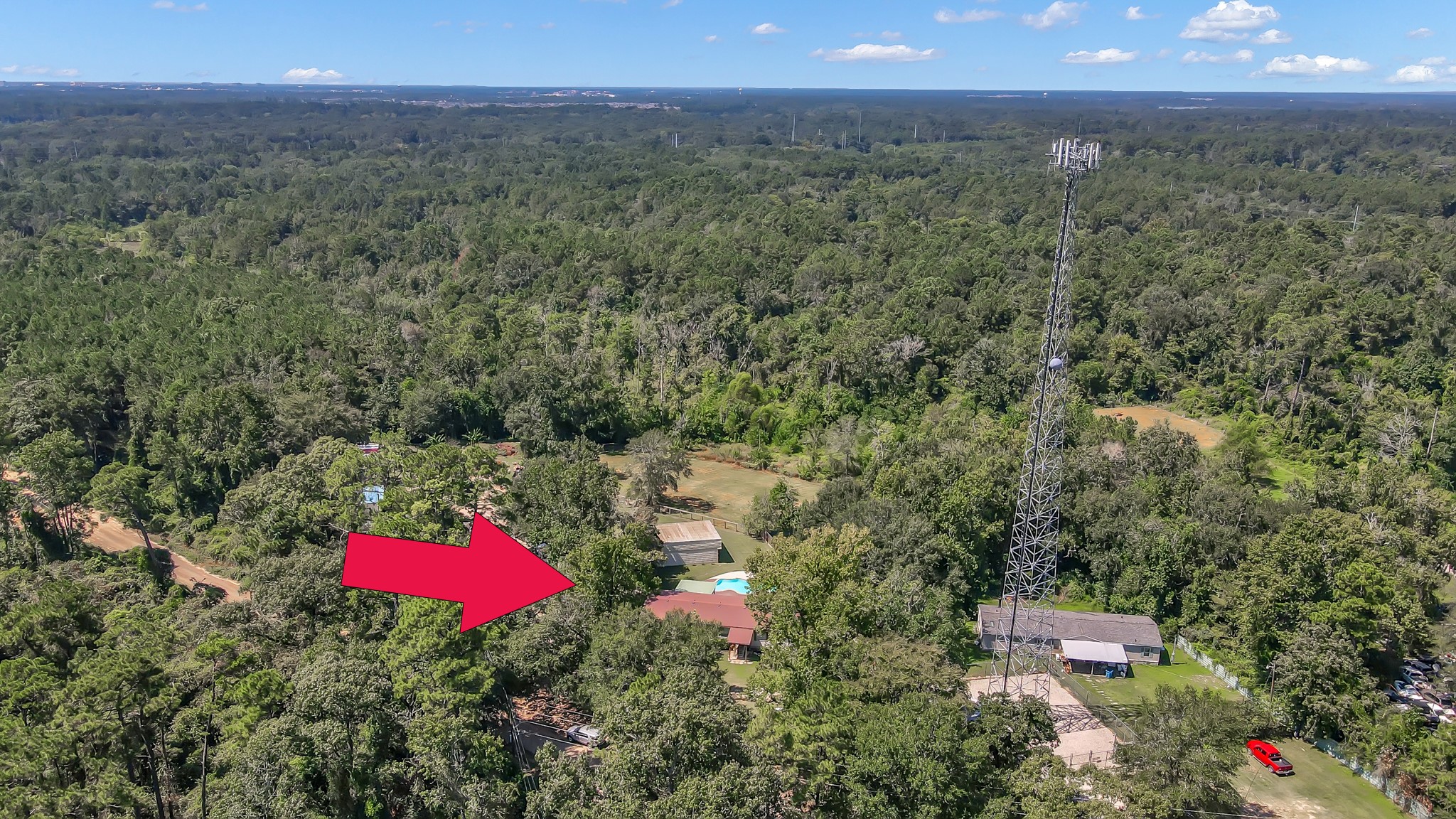 15350 Old Humble Pipeline Road Conroe, TX 77302 - Photo 37 of 38 an aerial view of a houses with a yard and mountain
