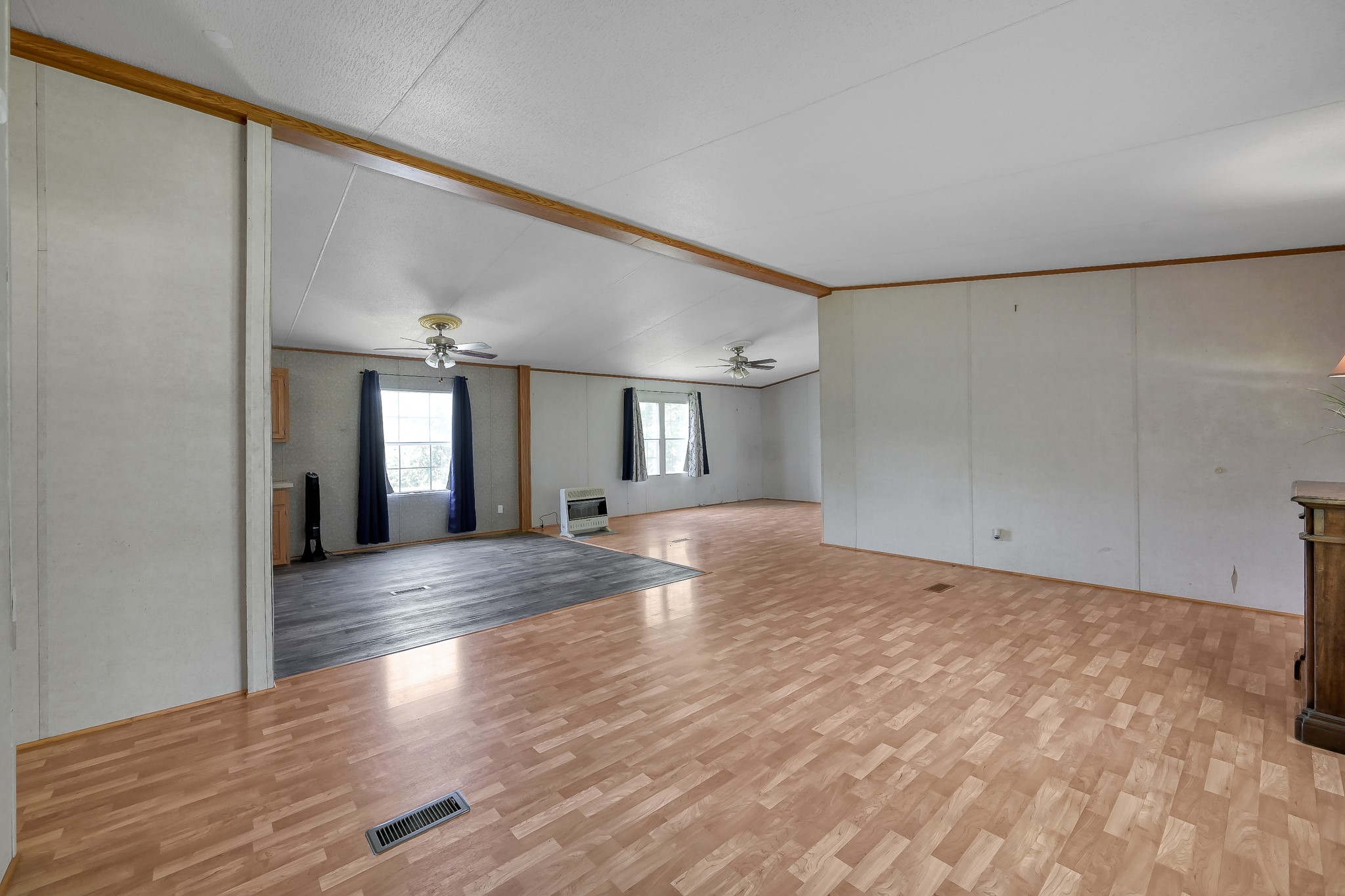 15350 Old Humble Pipeline Road Conroe, TX 77302 - Photo 4 of 38 a view of empty room with wooden floor and fan