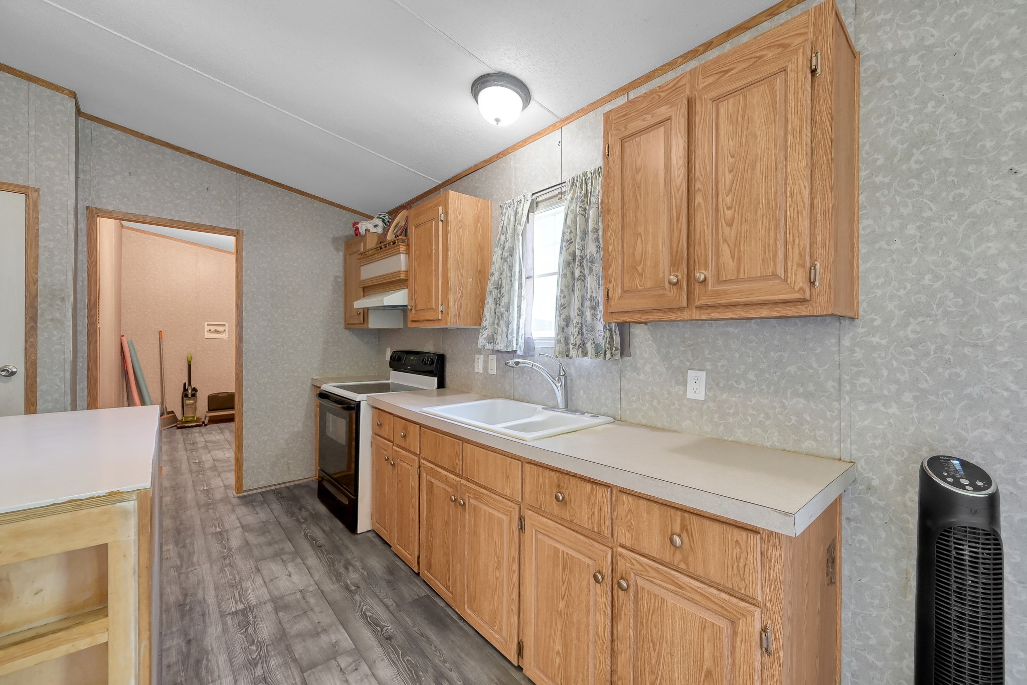 15350 Old Humble Pipeline Road Conroe, TX 77302 - Photo 6 of 38 a kitchen with a sink stove and cabinets