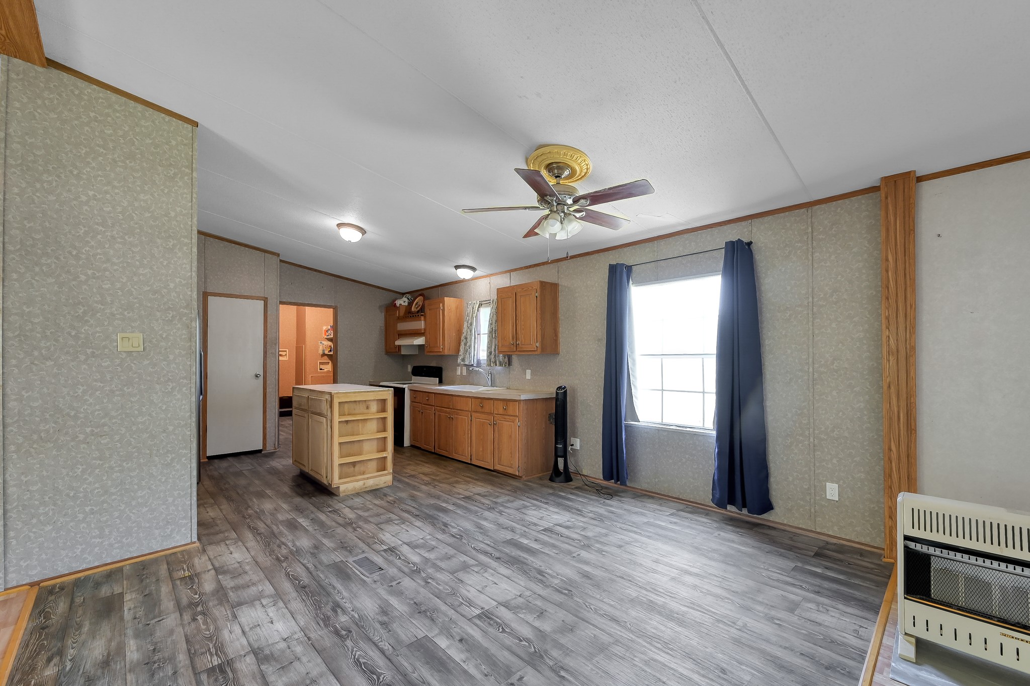 15350 Old Humble Pipeline Road Conroe, TX 77302 - Photo 8 of 38 a view of a kitchen with a sink and a window