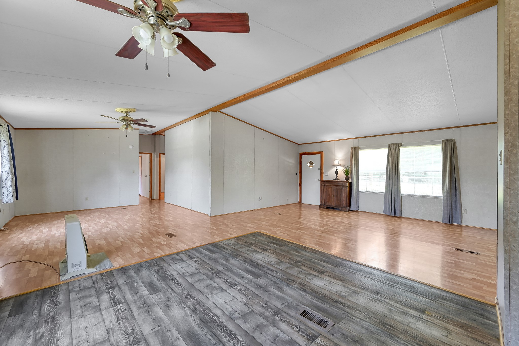 15350 Old Humble Pipeline Road Conroe, TX 77302 - Photo 9 of 38 a view of an empty room with window and wooden floor