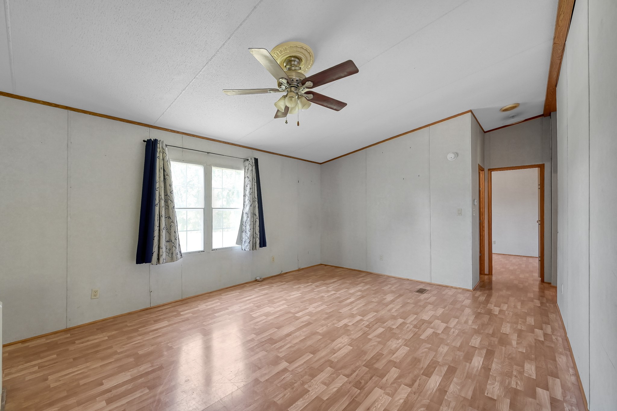 15350 Old Humble Pipeline Road Conroe, TX 77302 - Photo 10 of 38 wooden floor in an empty room with a window