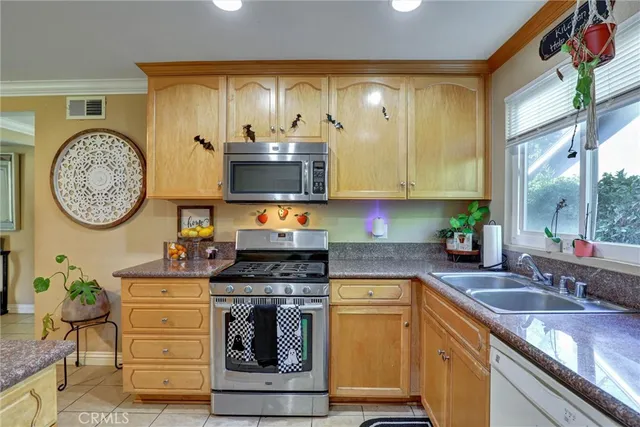 a view of a dining room with furniture and a potted plant