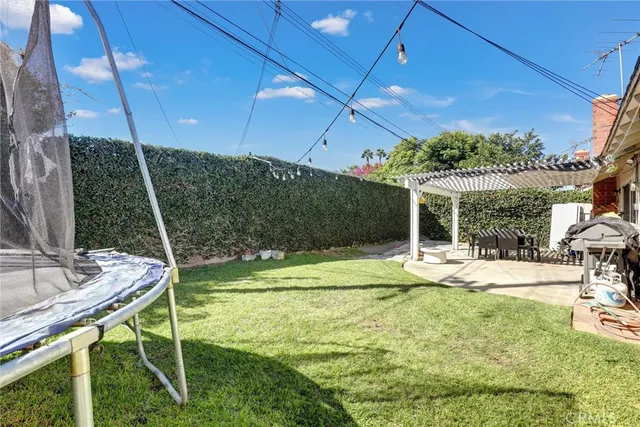 a view of yard with patio