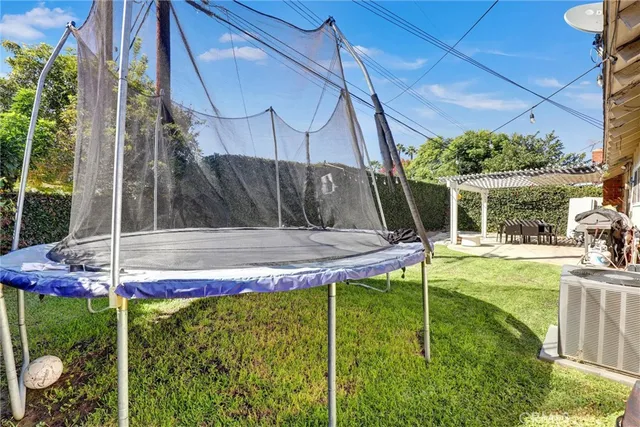 a view of a house with sitting area and yard