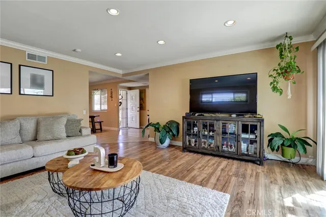 a kitchen with stainless steel appliances granite countertop a sink and a refrigerator