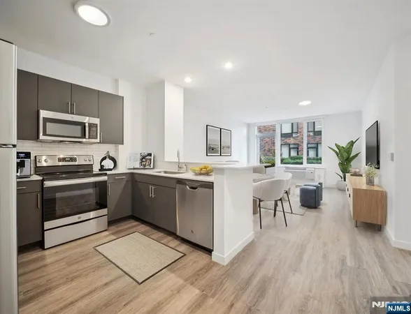 a large kitchen with a large counter top appliances and cabinets