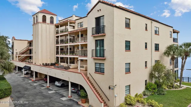 a view of a lake with building in front of house