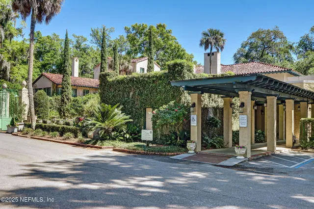 a view of a patio with table and chairs and potted plants
