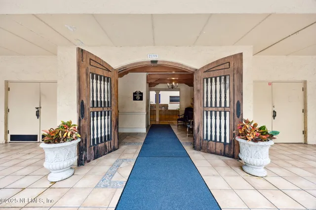 a view of a livingroom with furniture window and wooden floor