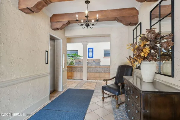 a view of staircase with wooden floor and white walls