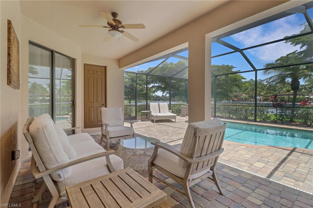 9434 Piacere Way Naples, FL 34113 - Photo 13 of 32 View of patio featuring an outdoor pool, outdoor lounge area, glass enclosure, and ceiling fan