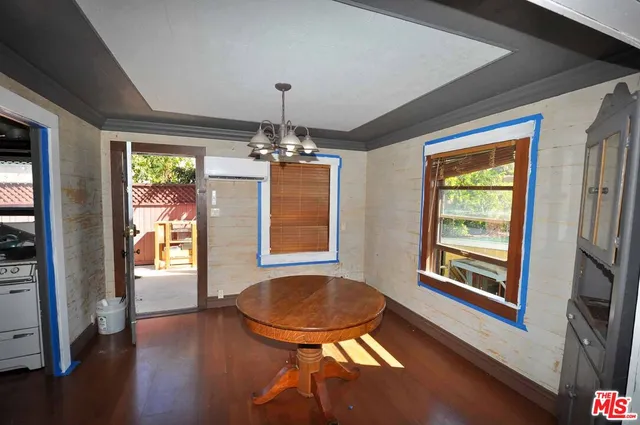 a view of a livingroom with furniture window and wooden floor