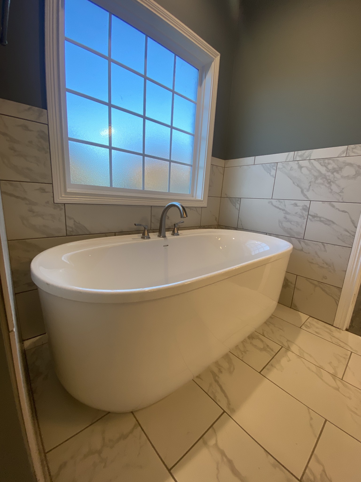 557 Dexter Drive Clarksville, TN 37043 - Photo 15 of 30 a white bath tub sitting in a bathroom