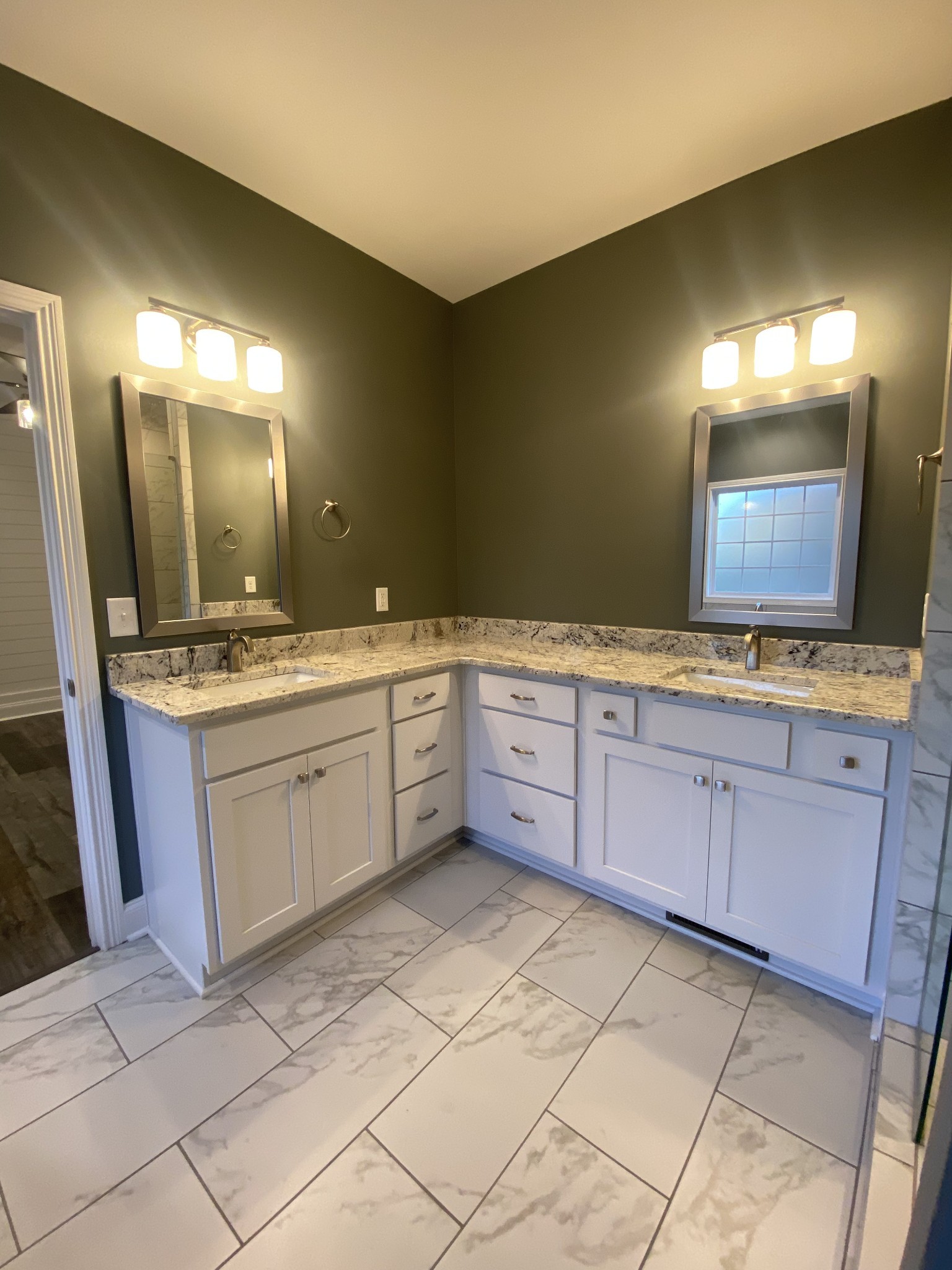 557 Dexter Drive Clarksville, TN 37043 - Photo 16 of 30 a spacious bathroom with a granite countertop sink and a mirror
