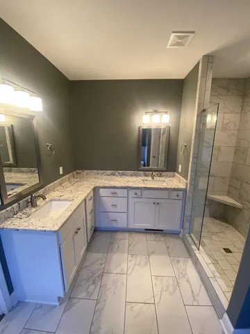 a bathroom with a shower and toilet