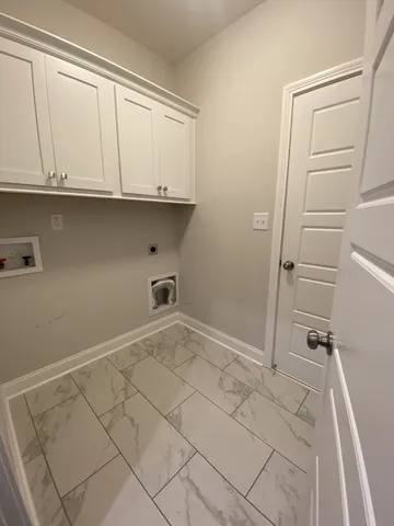 an empty room with a ceiling fan and a window