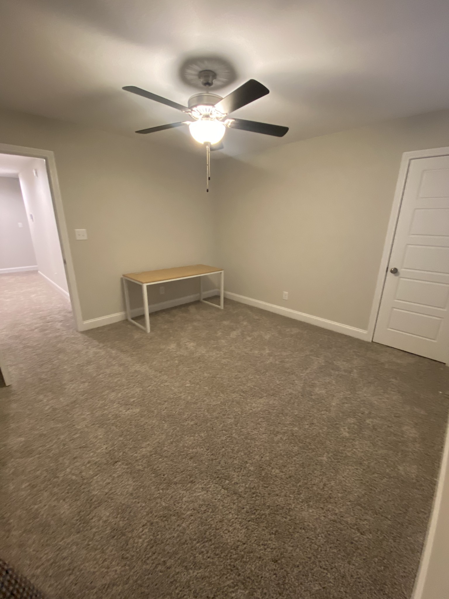 557 Dexter Drive Clarksville, TN 37043 - Photo 22 of 30 an empty room with a ceiling fan and a window
