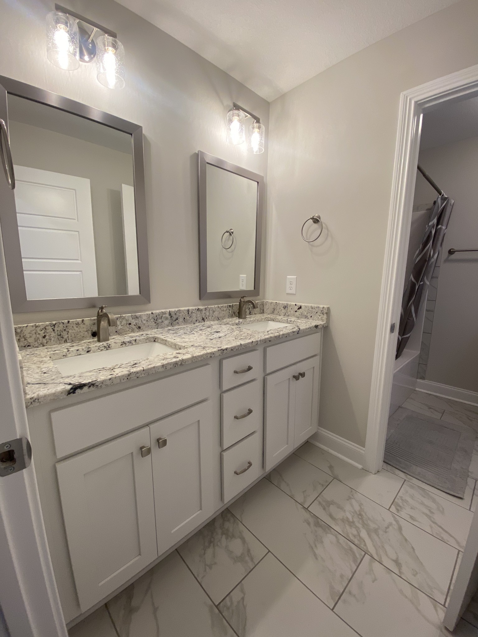 557 Dexter Drive Clarksville, TN 37043 - Photo 24 of 30 a spacious bathroom with a granite countertop sink a mirror and a