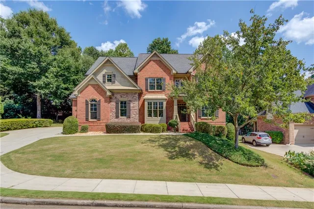 a front view of a house with a yard