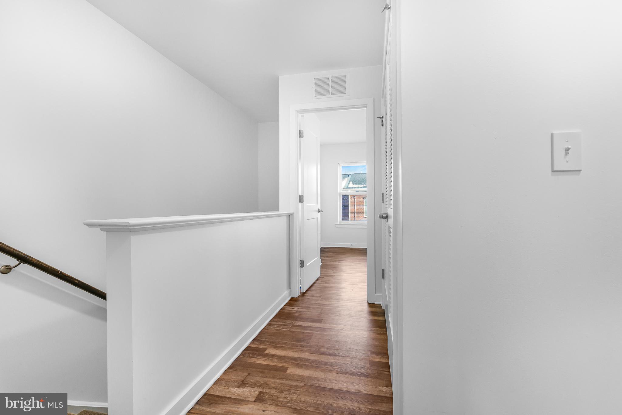 836 Bennett Street Wilmington, DE 19801 - Photo 39 of 66 a view of a hallway with wooden floor