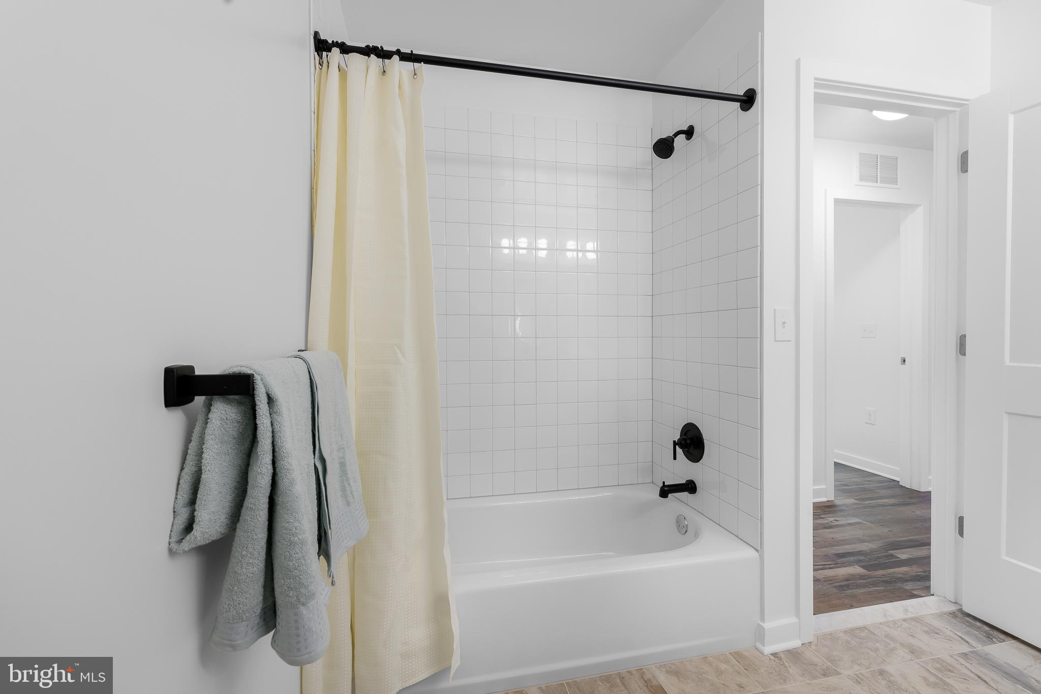 836 Bennett Street Wilmington, DE 19801 - Photo 45 of 66 a bathroom with a shower and a bath tub