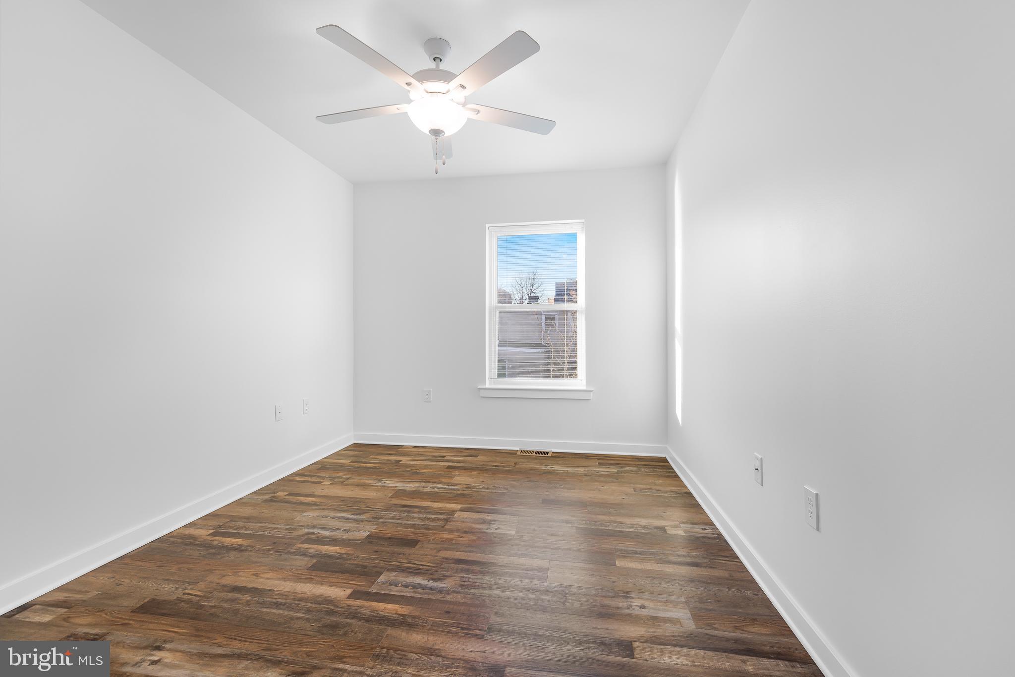 836 Bennett Street Wilmington, DE 19801 - Photo 46 of 66 wooden floor in an empty room with a window