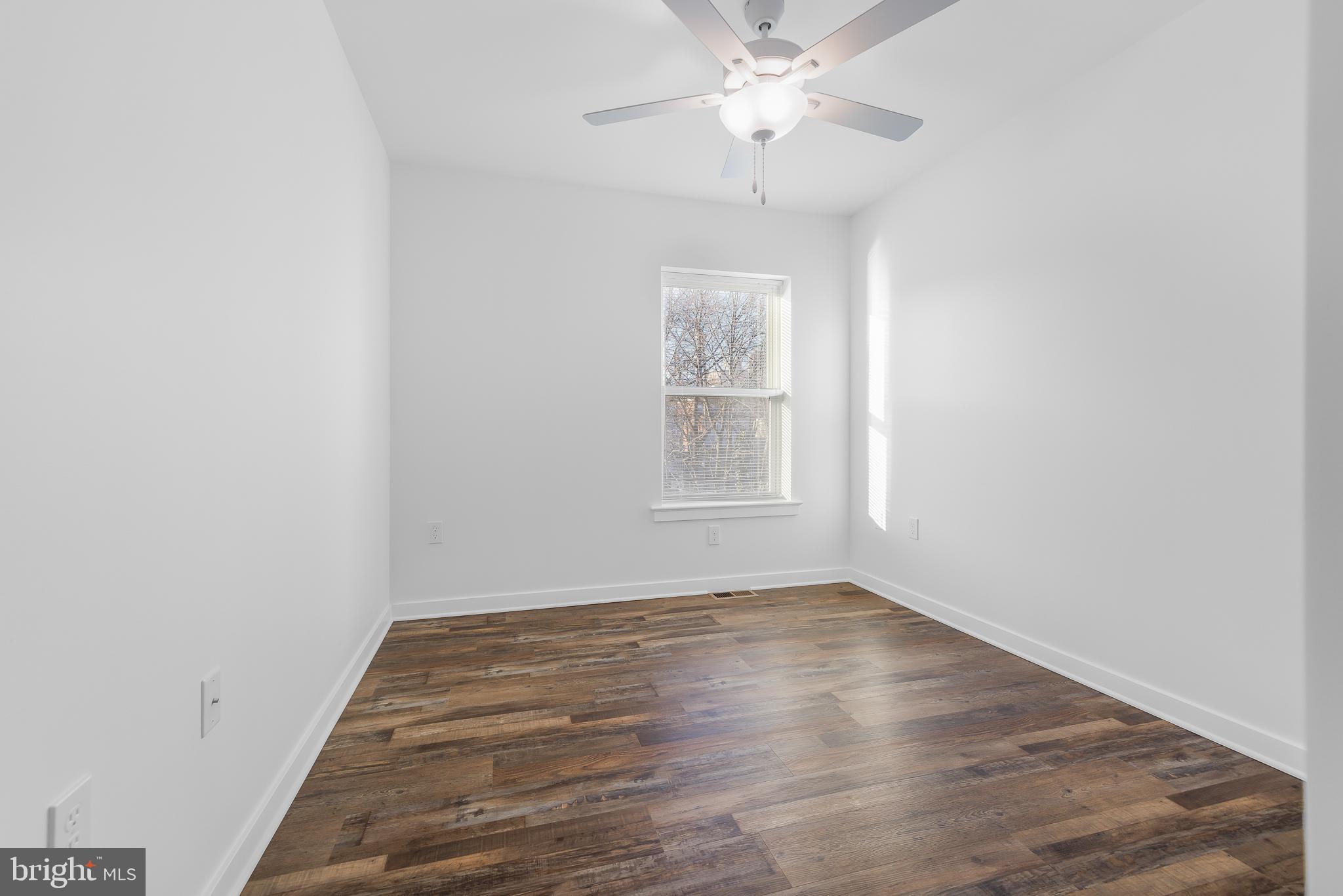 836 Bennett Street Wilmington, DE 19801 - Photo 48 of 66 wooden floor in an empty room with a window