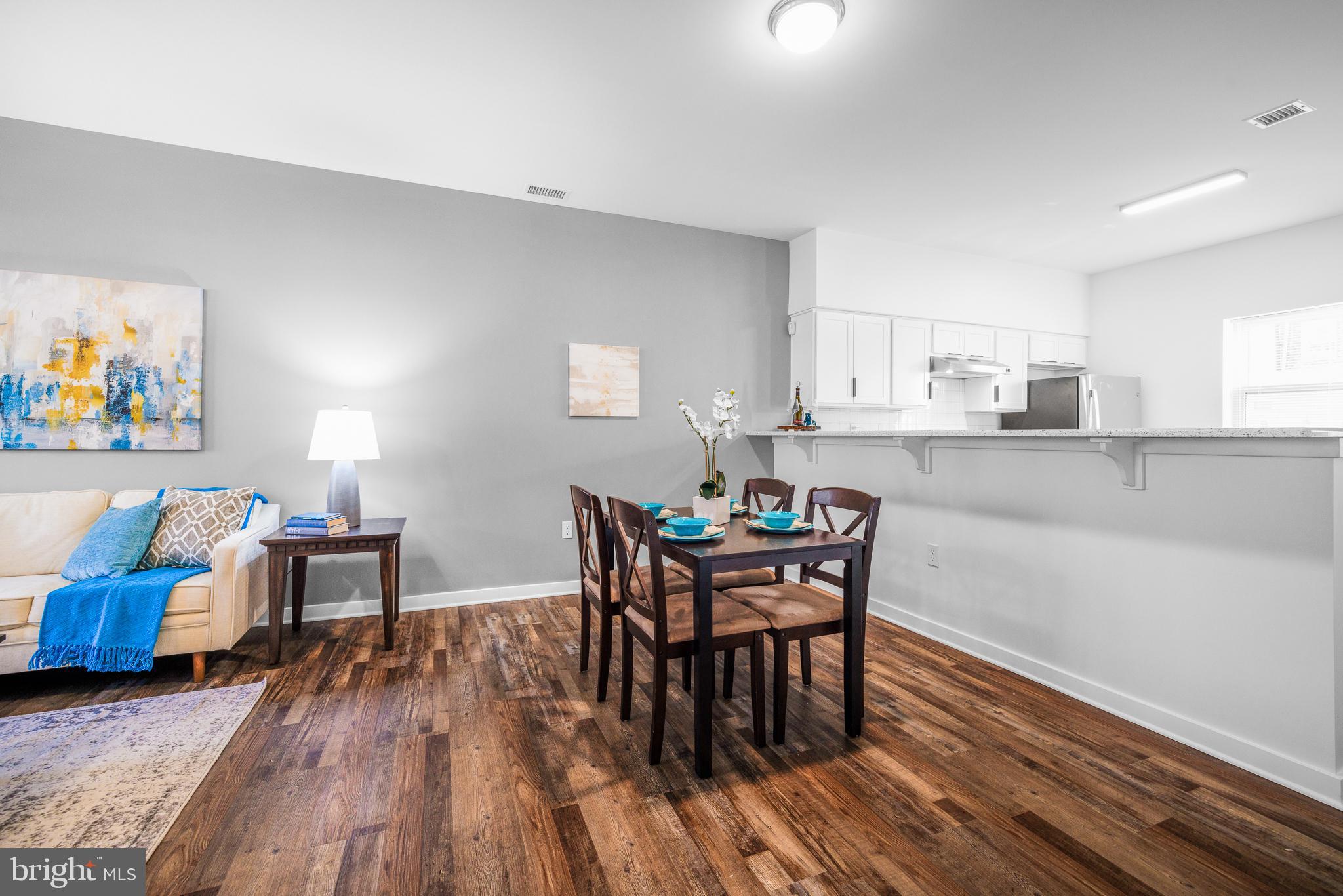 836 Bennett Street Wilmington, DE 19801 - Photo 55 of 66 a dining room with furniture and wooden floor