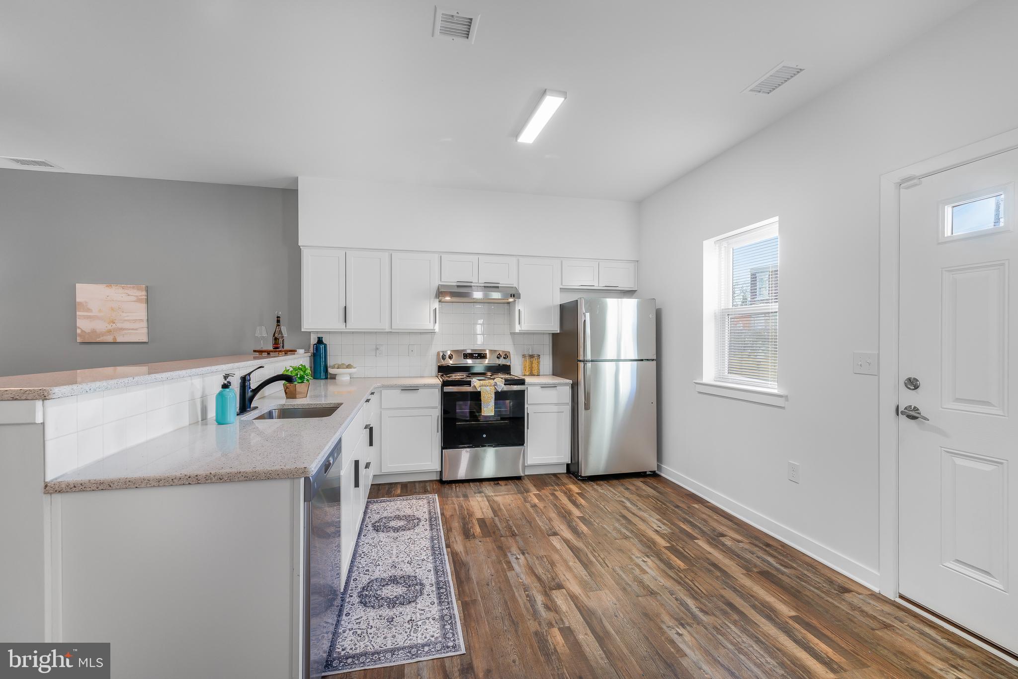 836 Bennett Street Wilmington, DE 19801 - Photo 57 of 66 a kitchen with a refrigerator and a stove