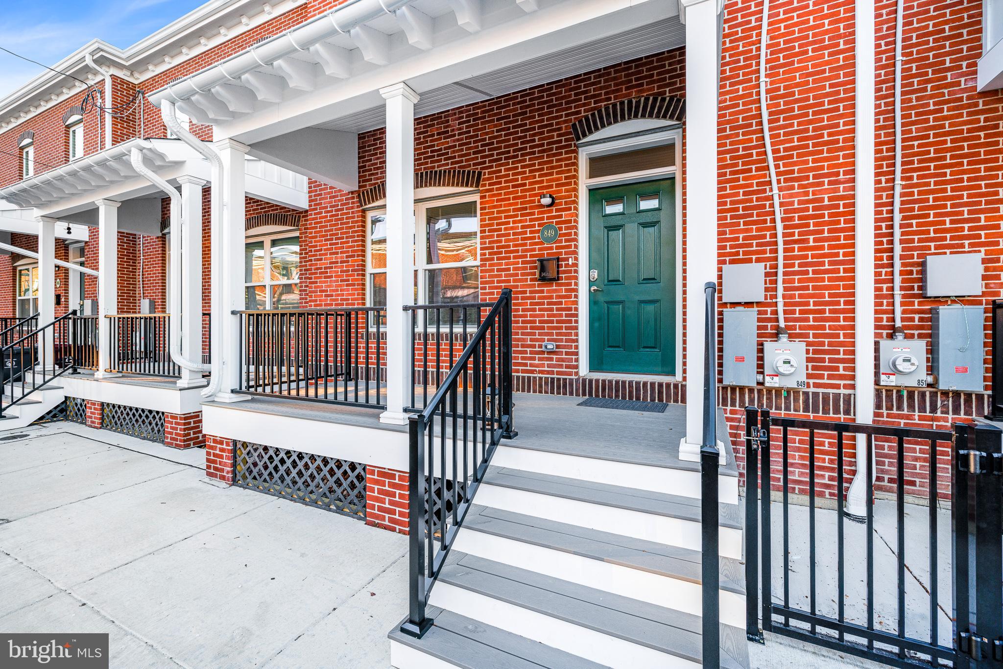 836 Bennett Street Wilmington, DE 19801 - Photo 61 of 66 a view of a brick house with a wooden fence