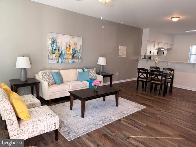 836 Bennett Street Wilmington, DE 19801 - Photo 10 of 66 a living room with furniture a rug and a table