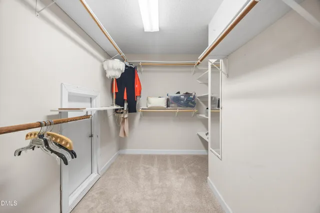 a view of a large house with a yard and plants