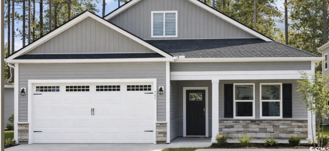 Craftsman-style house with a porch, roof with shingles, concrete driveway, an attached garage, and stone siding