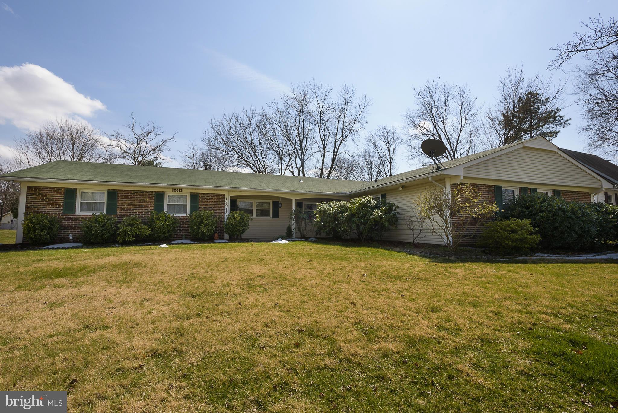 12013 Marvel Lane Bowie, MD 20715 - Photo 1 of 22 a front view of a house with yard and trees