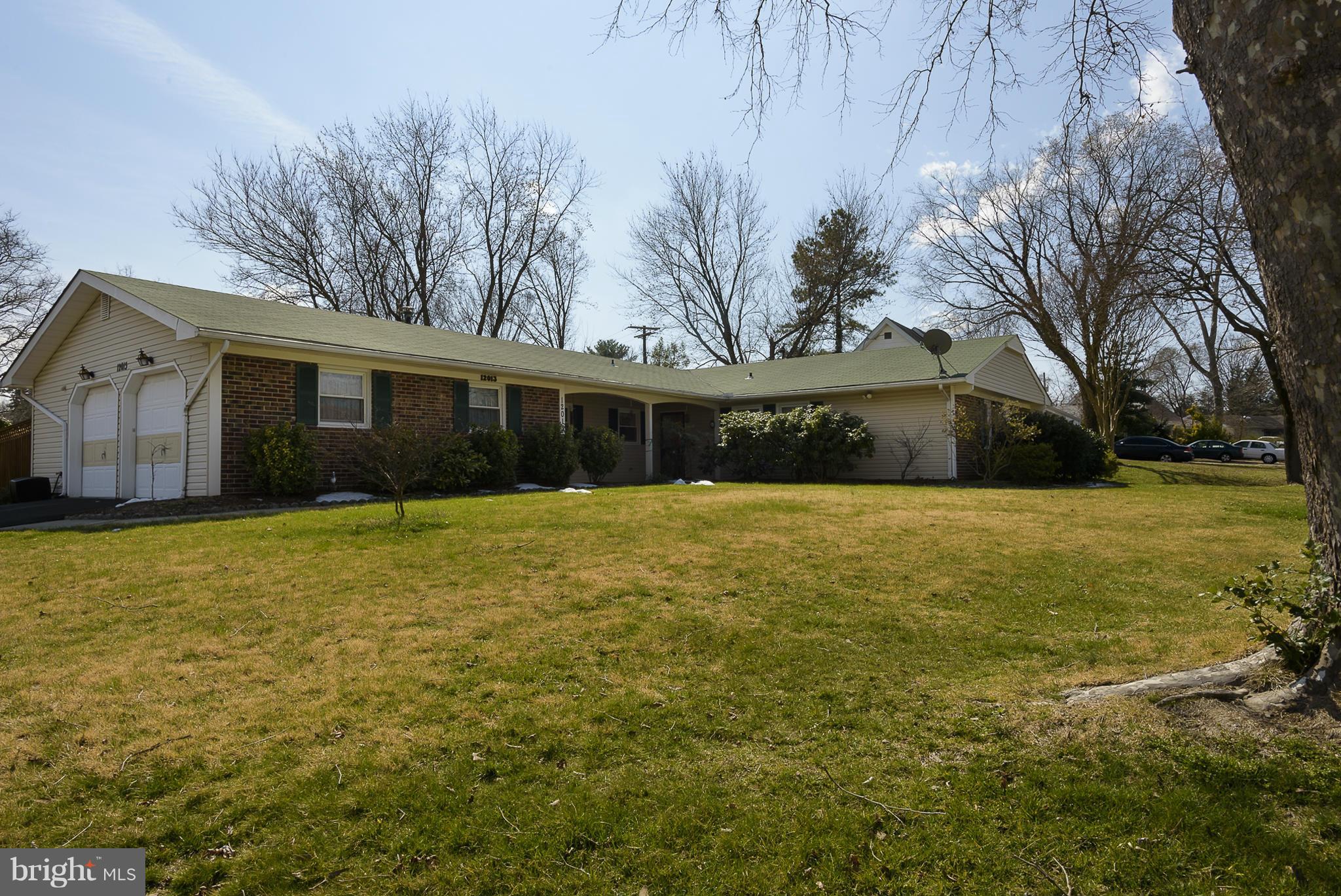 12013 Marvel Lane Bowie, MD 20715 - Photo 2 of 22 a front view of house with yard and trees