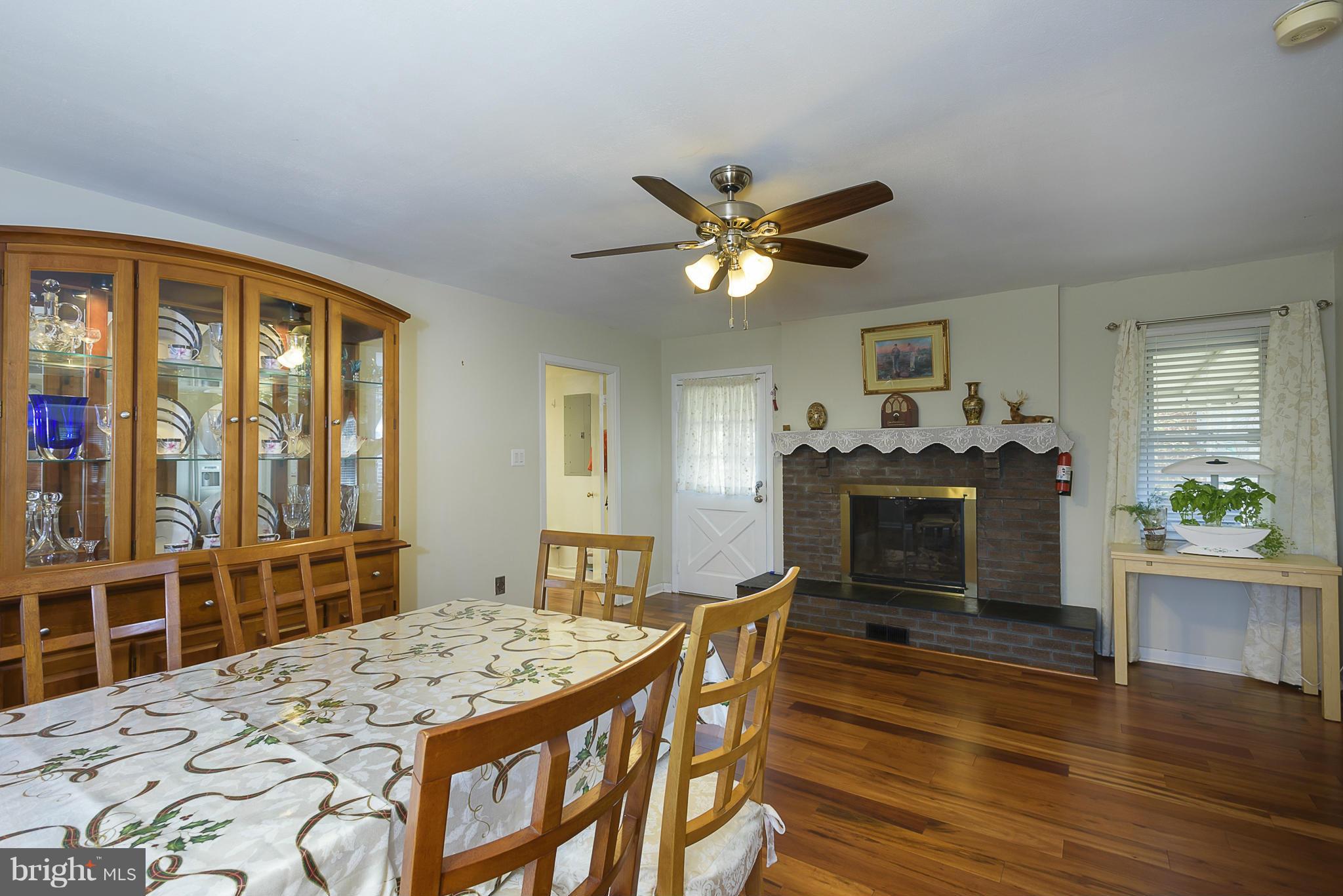 12013 Marvel Lane Bowie, MD 20715 - Photo 12 of 22 a dining room with wooden floor and chandelier
