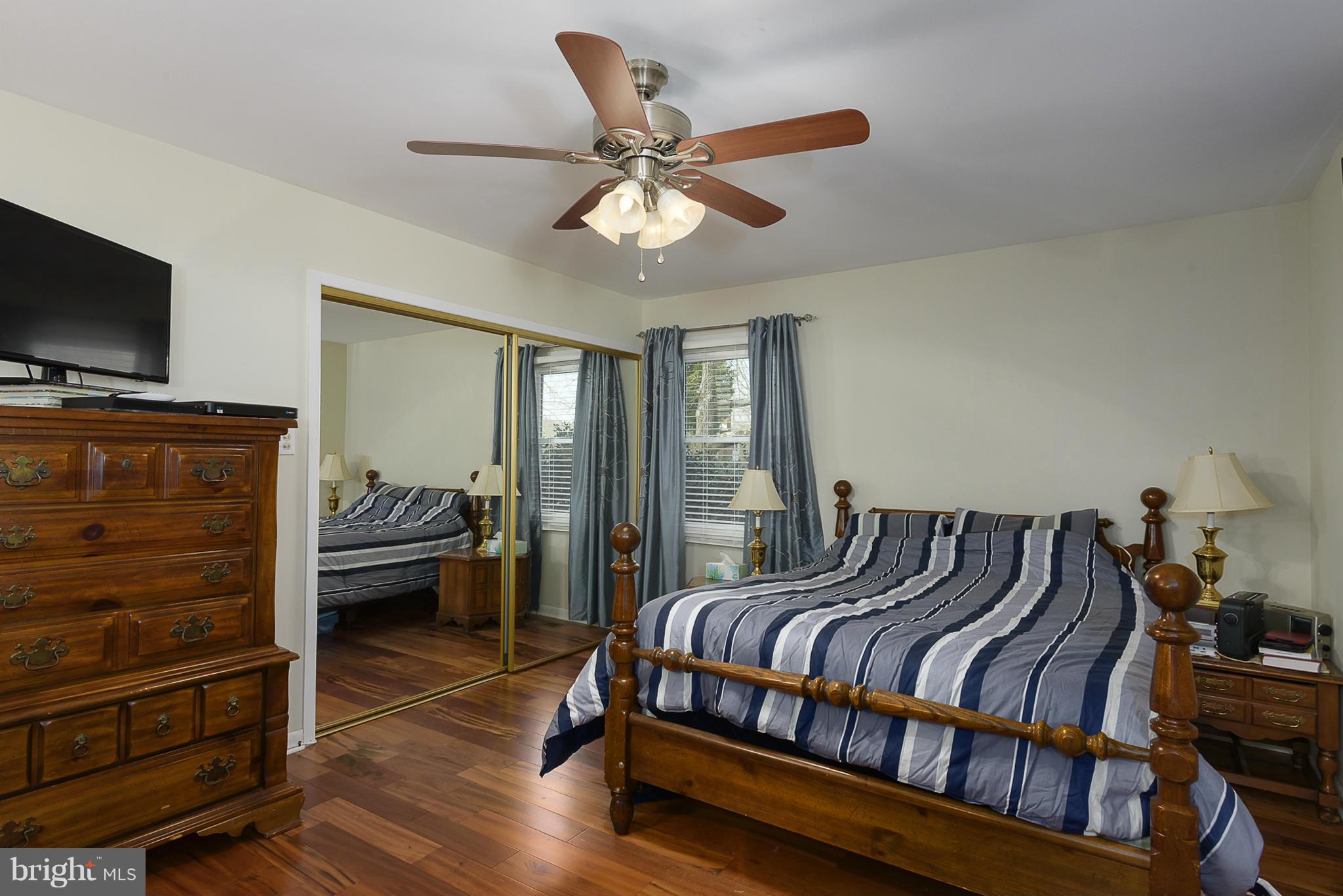 12013 Marvel Lane Bowie, MD 20715 - Photo 15 of 22 a bedroom with furniture and a flat screen tv