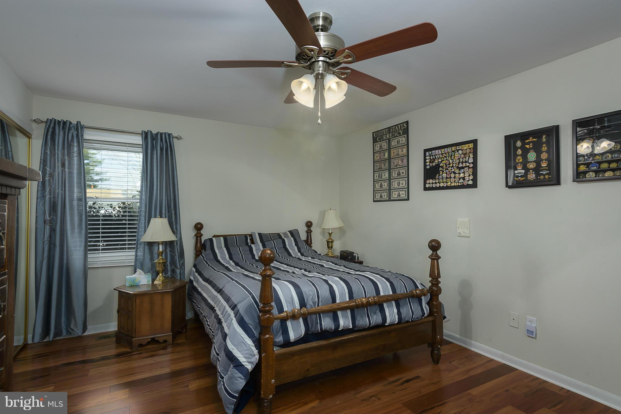 12013 Marvel Lane Bowie, MD 20715 - Photo 16 of 22 a bedroom with a bed and window