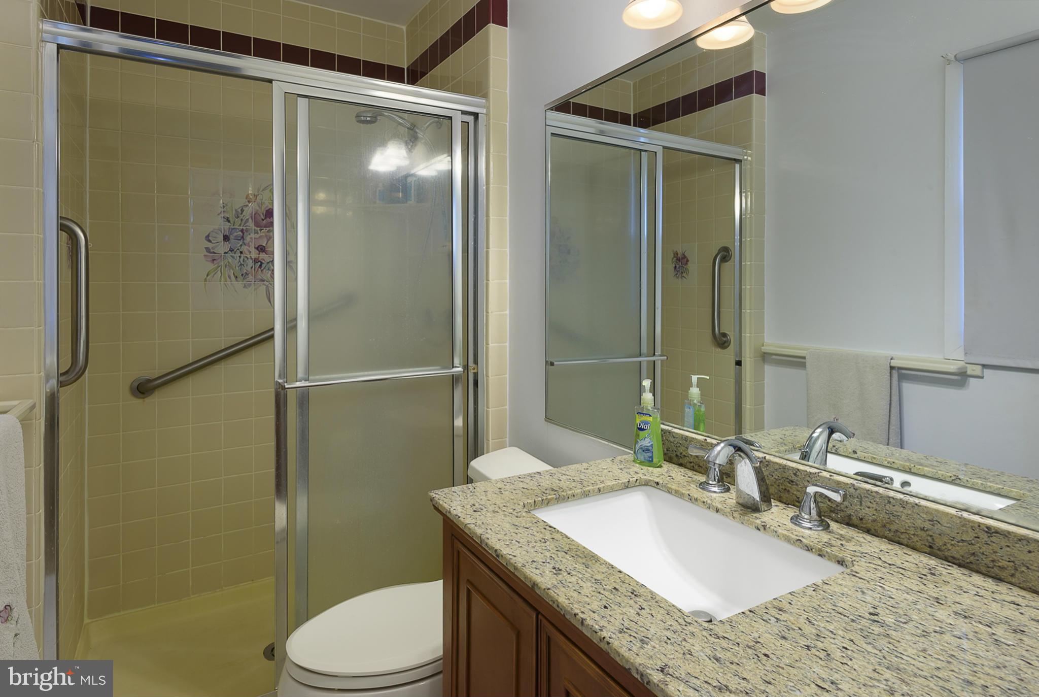 12013 Marvel Lane Bowie, MD 20715 - Photo 17 of 22 a bathroom with a granite countertop shower sink vanity mirror and toilet