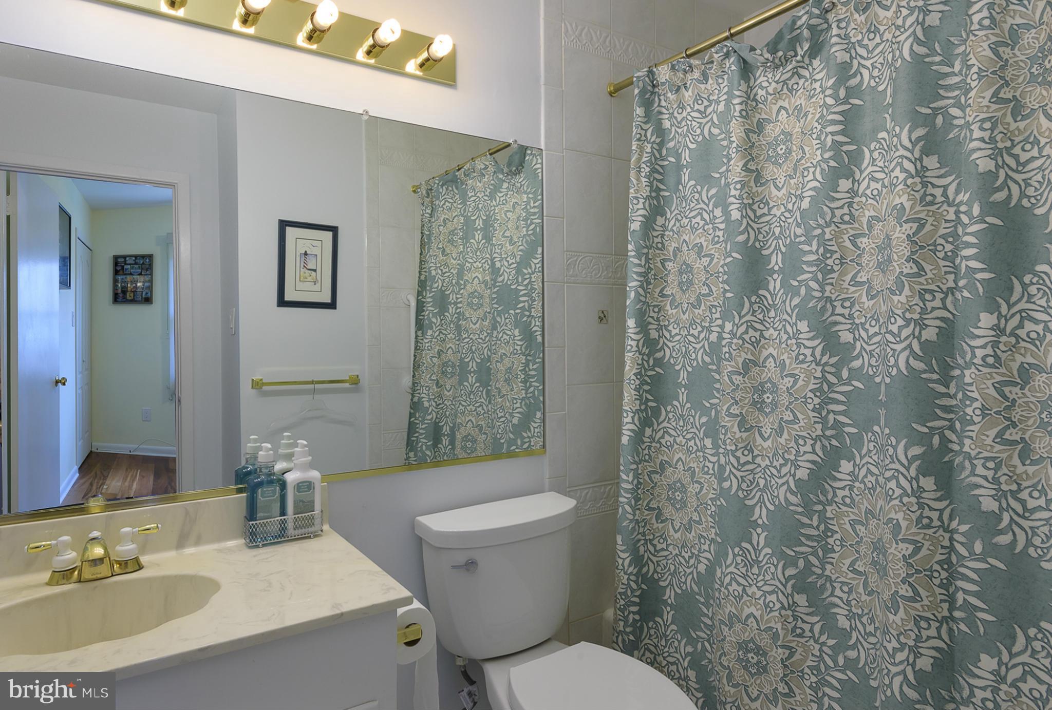 12013 Marvel Lane Bowie, MD 20715 - Photo 18 of 22 a bathroom with a sink toilet and shower