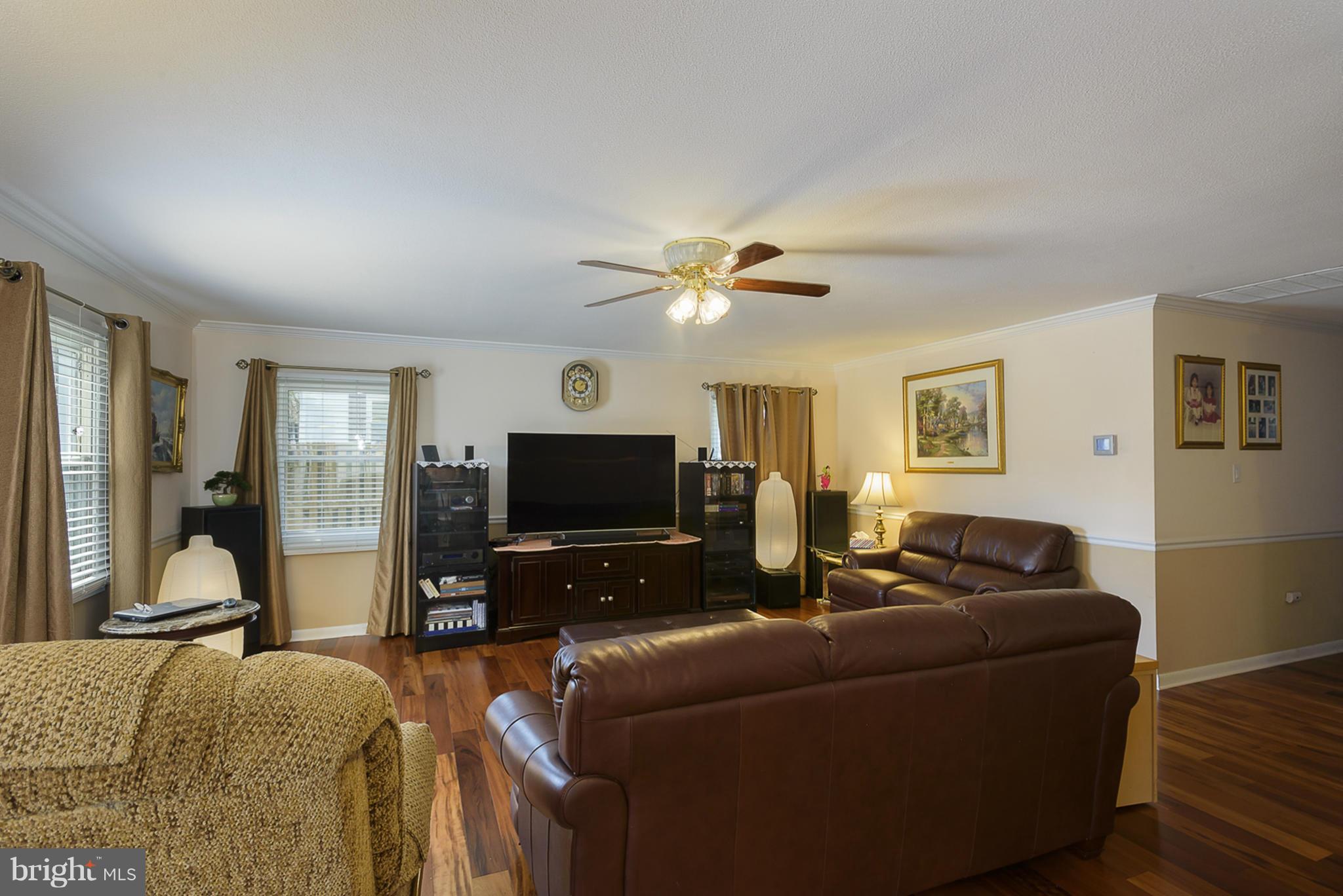 12013 Marvel Lane Bowie, MD 20715 - Photo 5 of 22 a living room with furniture and a flat screen tv