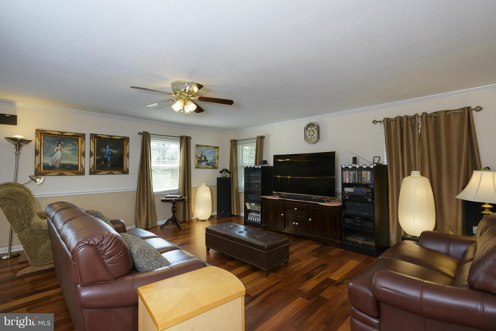 12013 Marvel Lane Bowie, MD 20715 - Photo 6 of 22 a living room with furniture and a flat screen tv