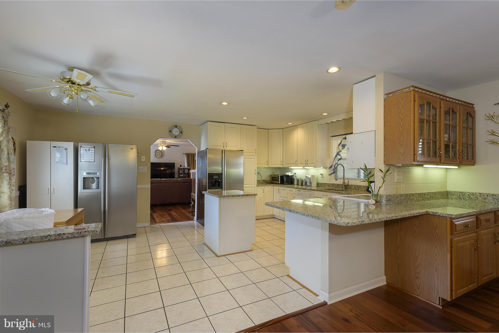 12013 Marvel Lane Bowie, MD 20715 - Photo 7 of 22 a kitchen with stainless steel appliances granite countertop a sink and cabinets