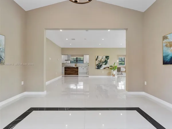 a view of living room with furniture and flat screen tv