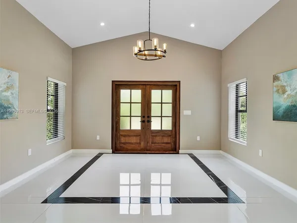 a view of an empty room with a window