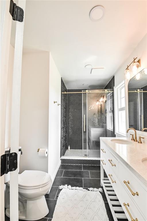 150 Sims Street Winder, GA 30680 - Photo 5 of 61 a bathroom with a double vanity sink toilet and shower